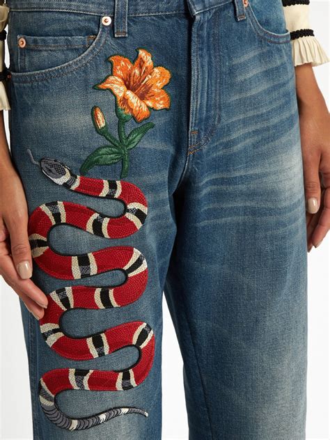 gucci snake jeans fake